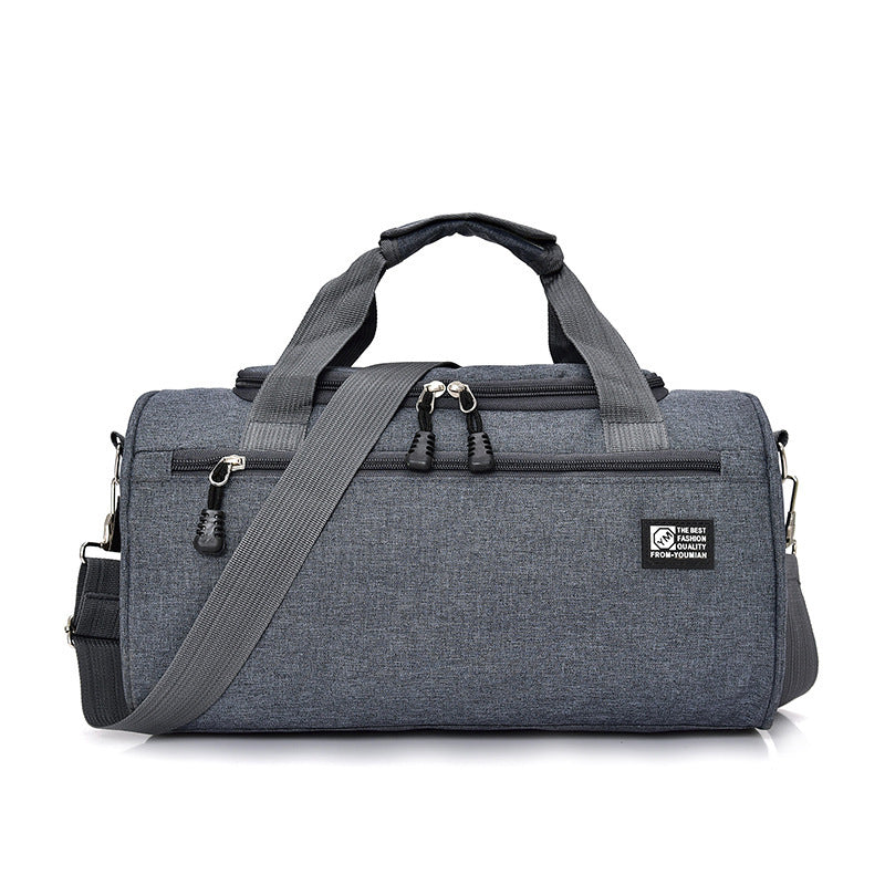 Gray duffel bag with shoulder strap on a white background