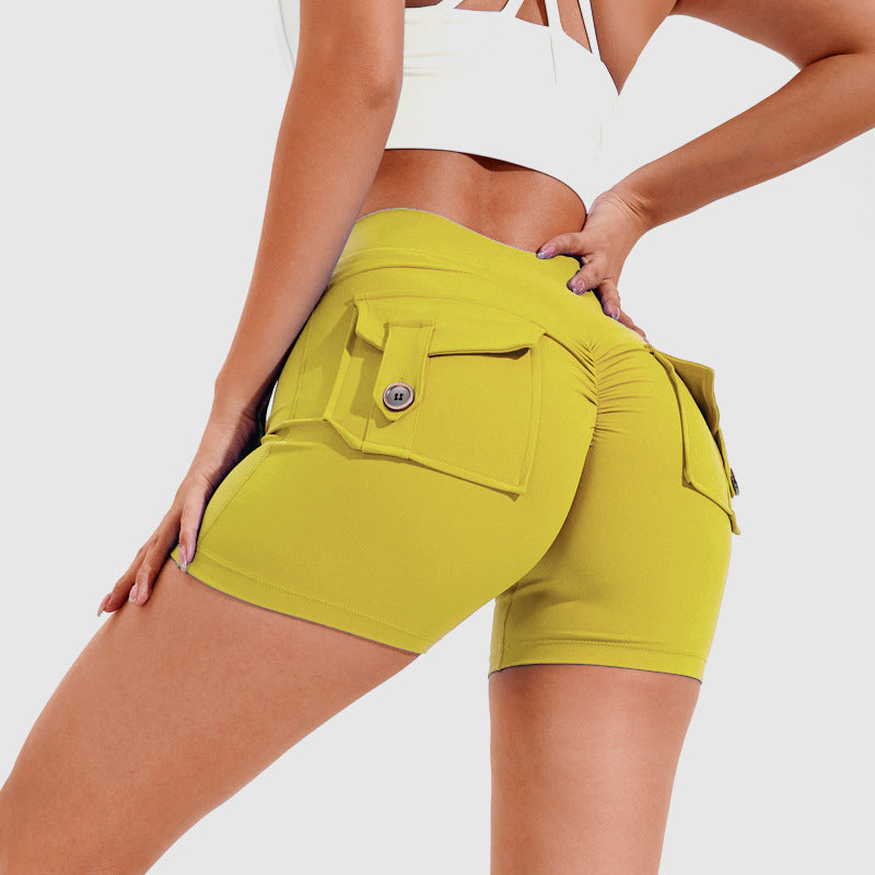 Person wearing bright yellow shorts on a white background