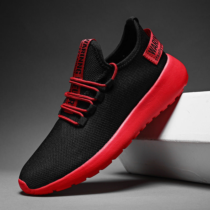 Black and red sneaker with a dark gray background