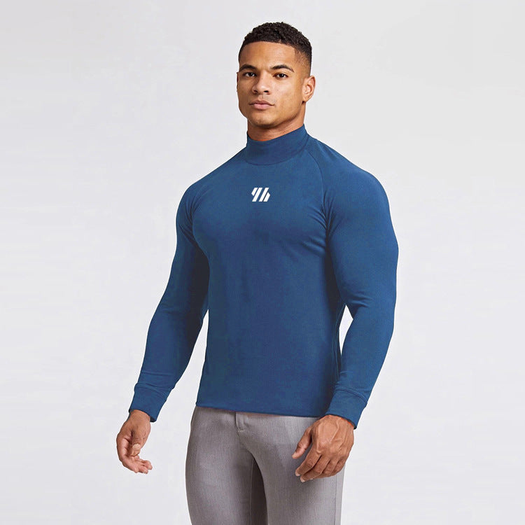 Man wearing a blue long-sleeve athletic shirt with a logo on a white background