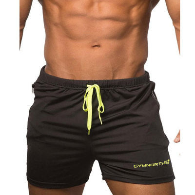 Black shorts with a yellow drawstring and brand logo on a white background