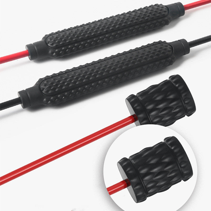 Black textured grips with red cables on a white background