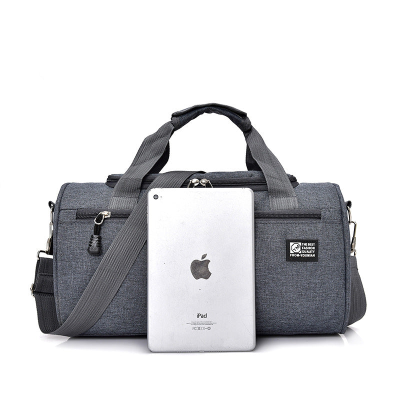 Gray duffel bag with a smartphone on a white background