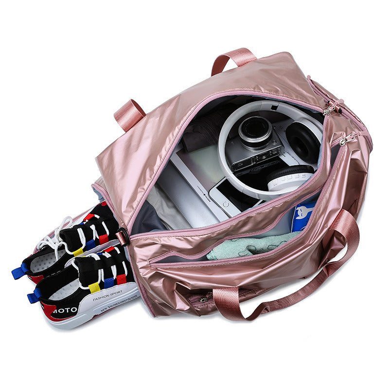 Pink travel bag with a helmet and shoes on a white background