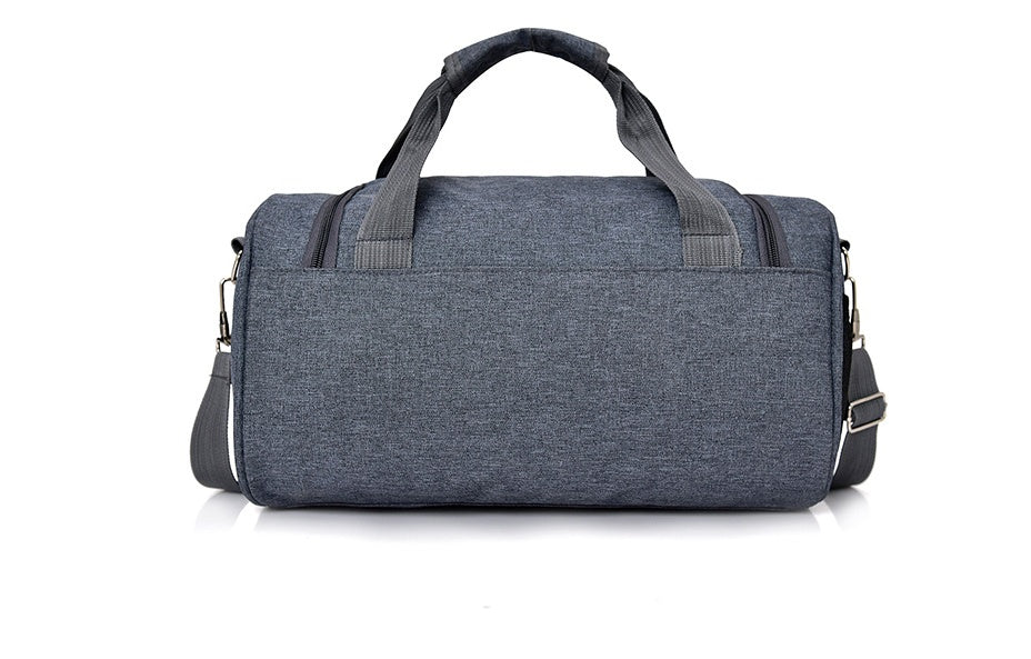 Blue duffel bag with gray handle on a white background