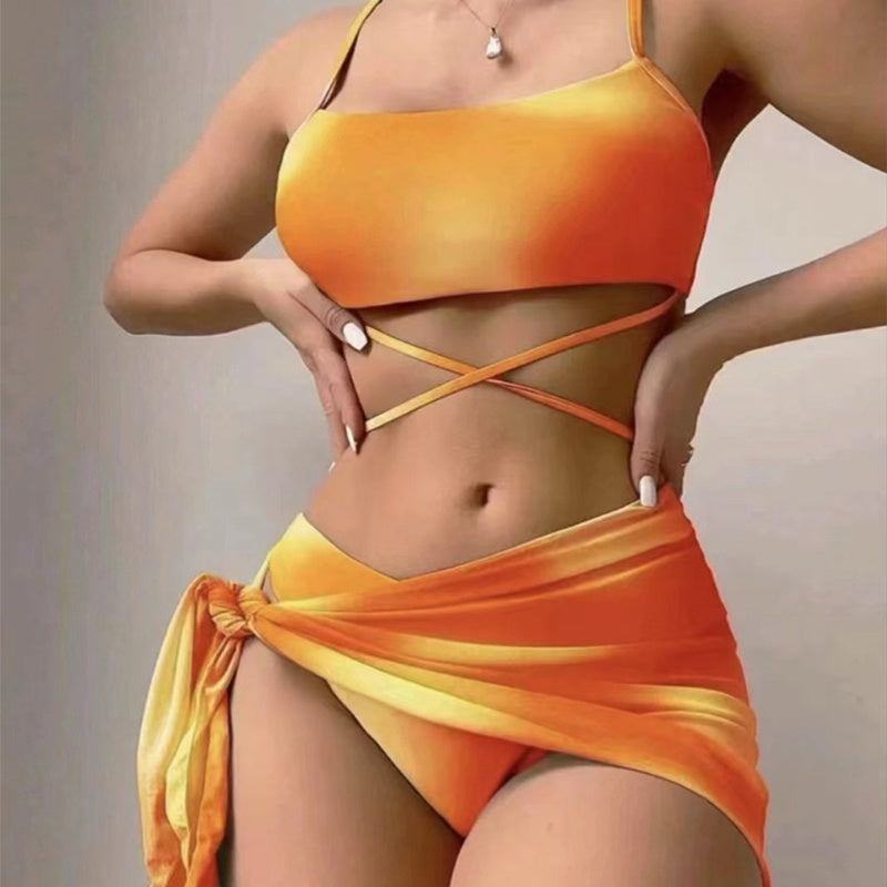 Orange bikini set with a matching wrap on a neutral background