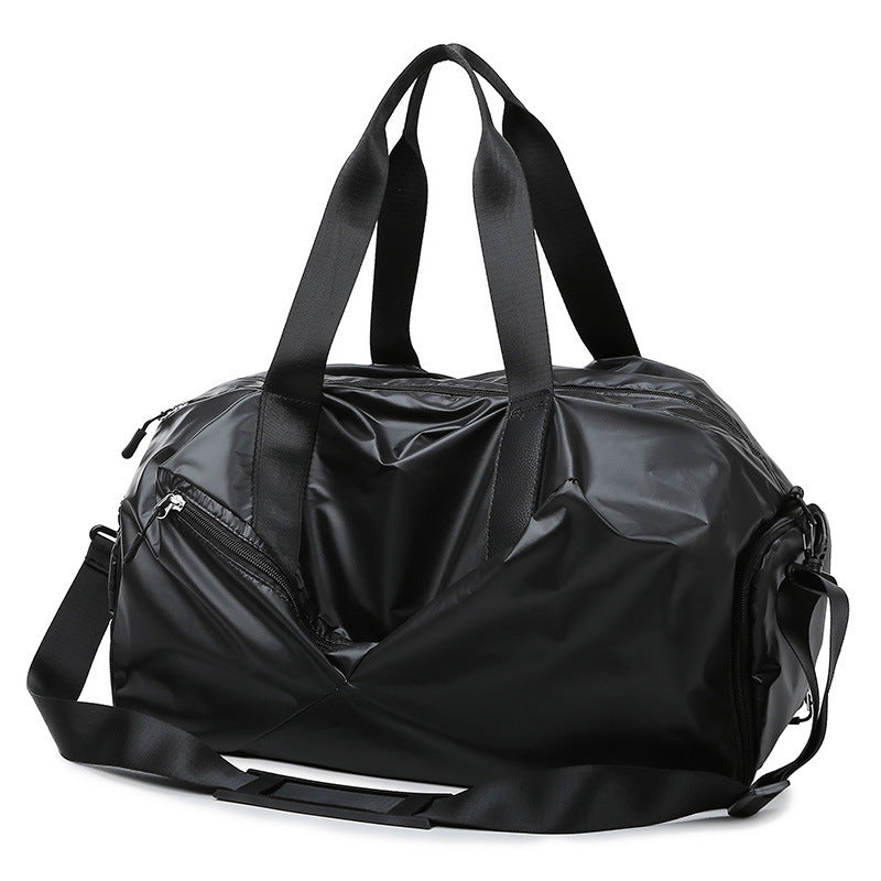 Black duffel bag with multiple zippers on a white background