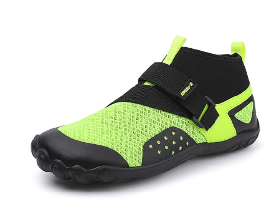 Green and black water shoe with a strap on a white background
