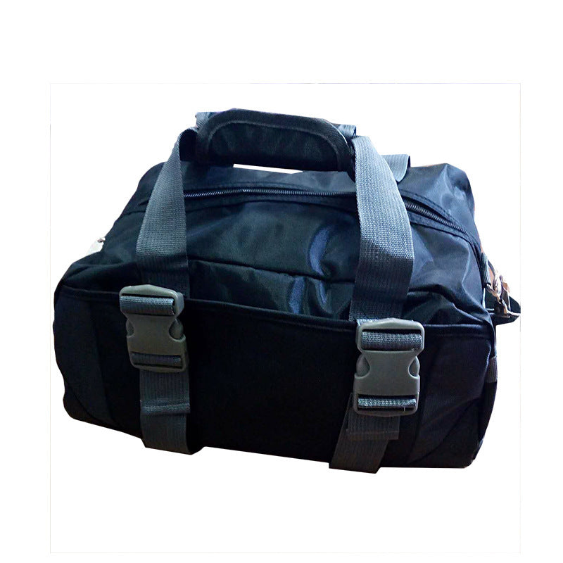 Black duffel bag with gray straps on a white background