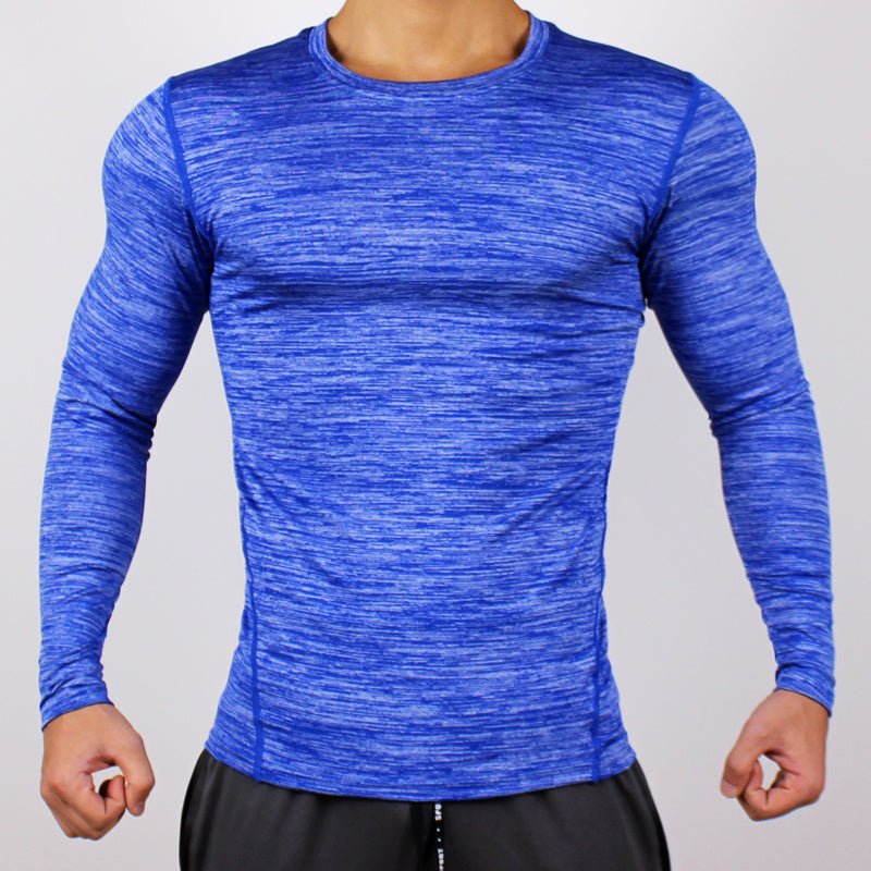 Blue long-sleeve athletic shirt worn by a person on a gray background