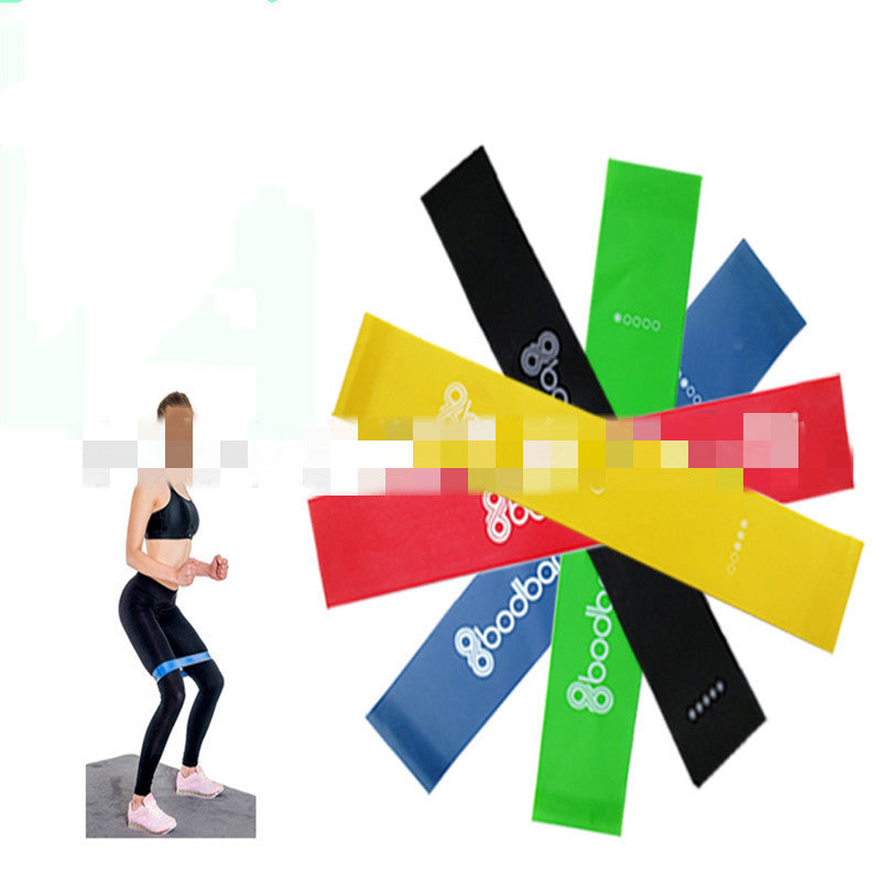 Set of colorful resistance bands with 'Gooddo' branding, displayed with a person exercising.