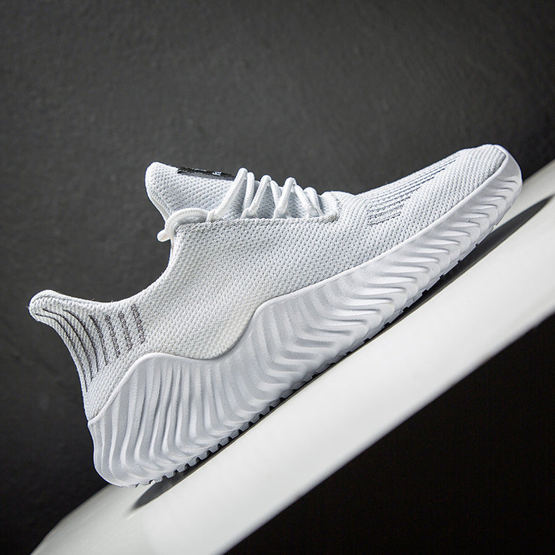 White athletic shoe on a dark background