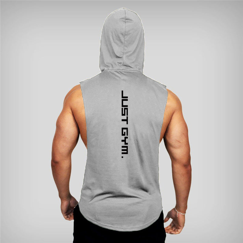 Person wearing a gray sleeveless hoodie with 'JUST GYM' text on the back against a gray background