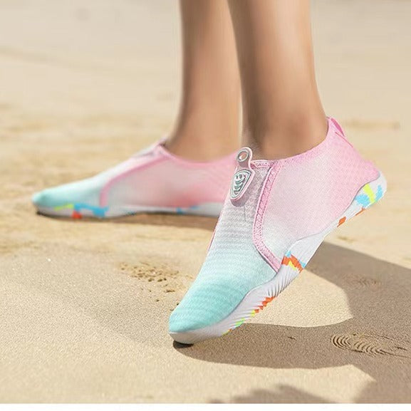 Colorful water shoes on a sandy beach