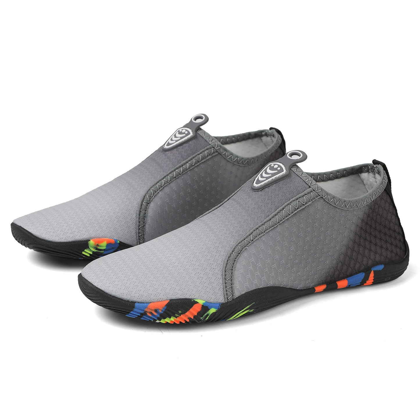 Pair of gray water shoes with colorful sole on a white background
