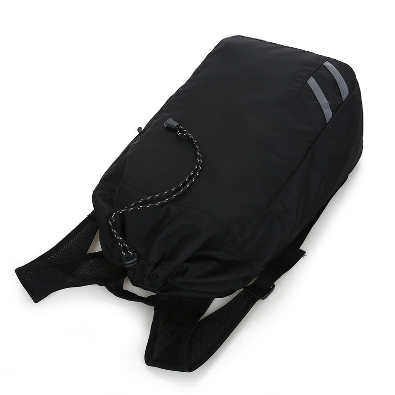 Black waist bag with a strap on a white background