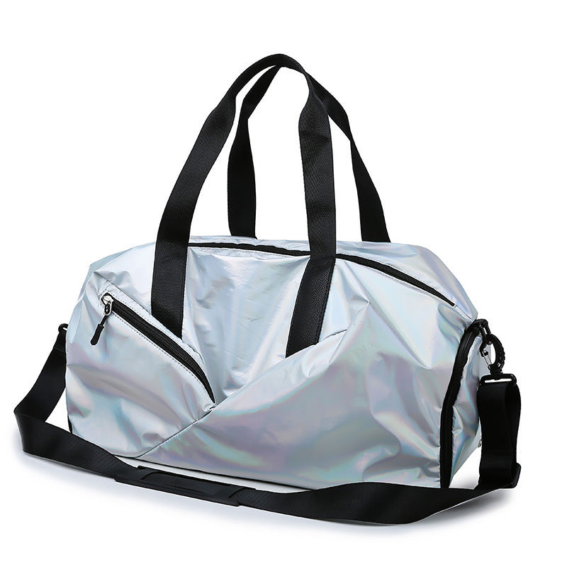 Silver holographic duffel bag with black straps on a white background