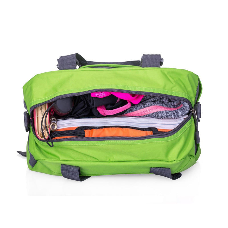 Green backpack with open front compartment showing colorful items on a white background