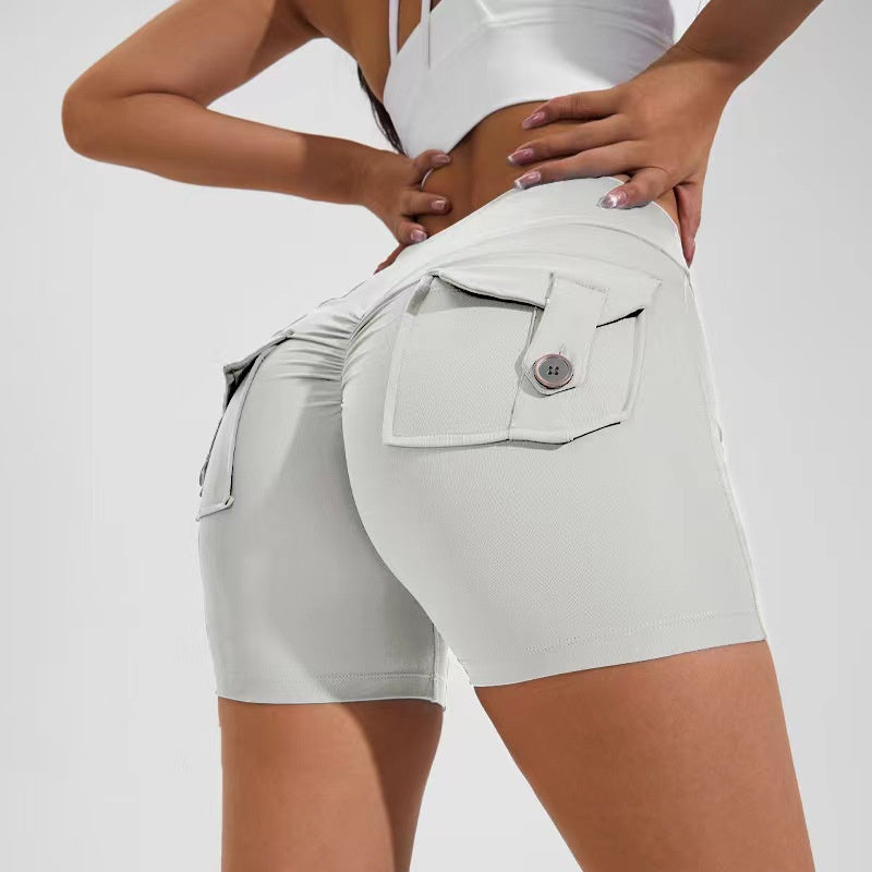 White shorts with a pocket detail on a plain background