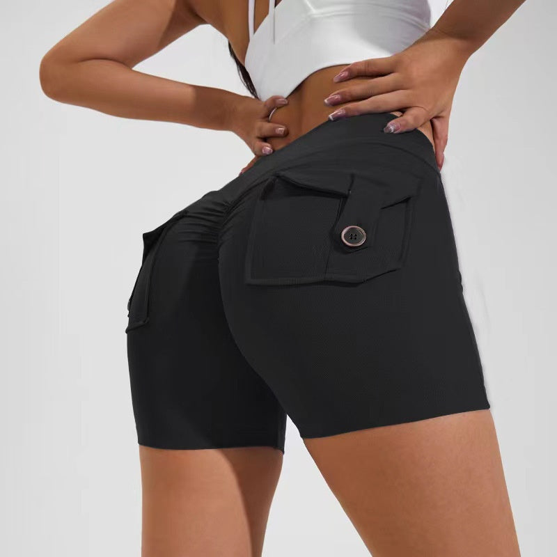 Black shorts with a pocket detail on a plain background