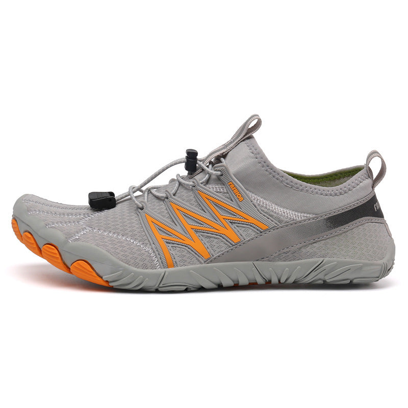 Gray and orange athletic shoe on a white background