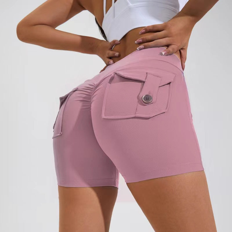 Pink shorts worn by a person on a plain background