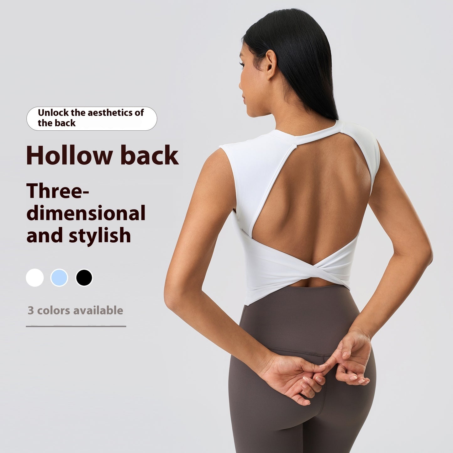 Woman wearing a white top with an open back design on a gray background
