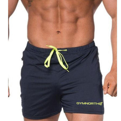 Navy shorts with yellow drawstring and brand logo on a white background