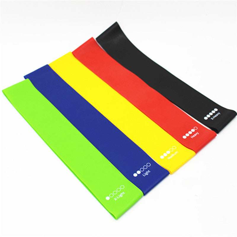 Set of colorful resistance bands on a white background