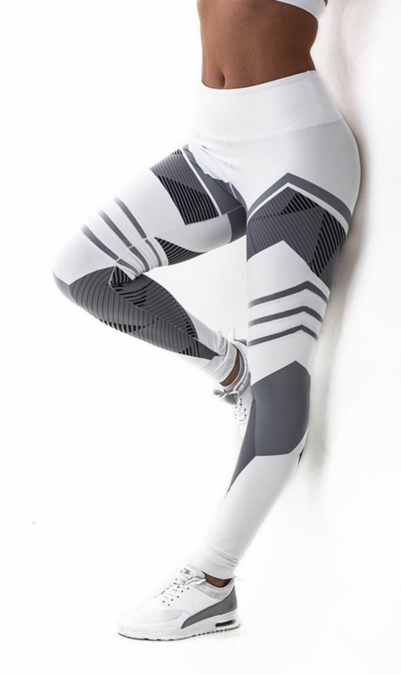 Person wearing white and gray patterned leggings on a white background