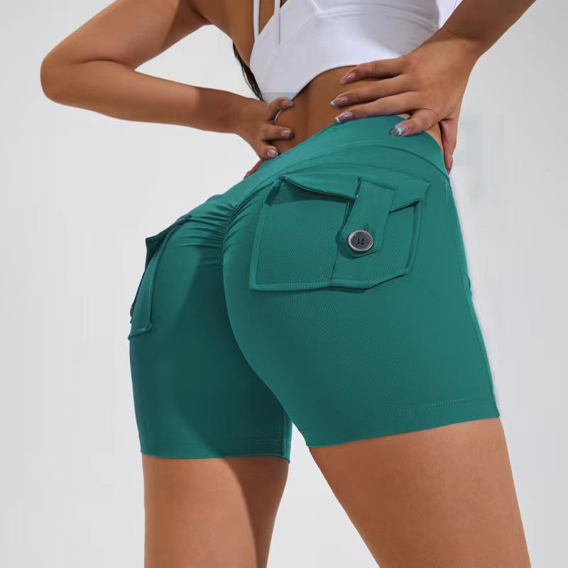 Green shorts with a pocket detail on a plain background