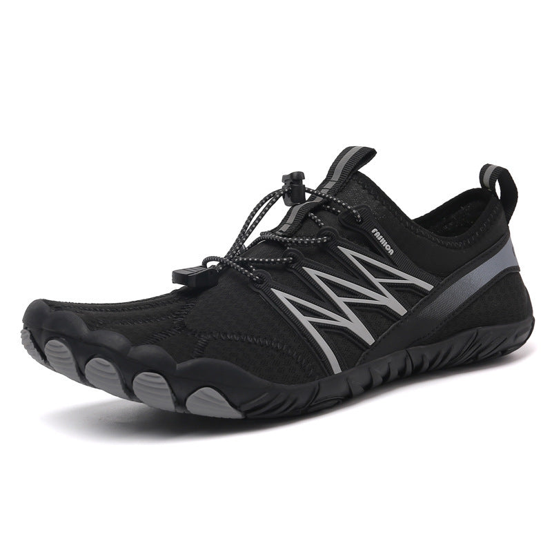 Black and gray athletic shoe on a white background
