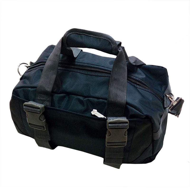 Black duffel bag with straps on a white background