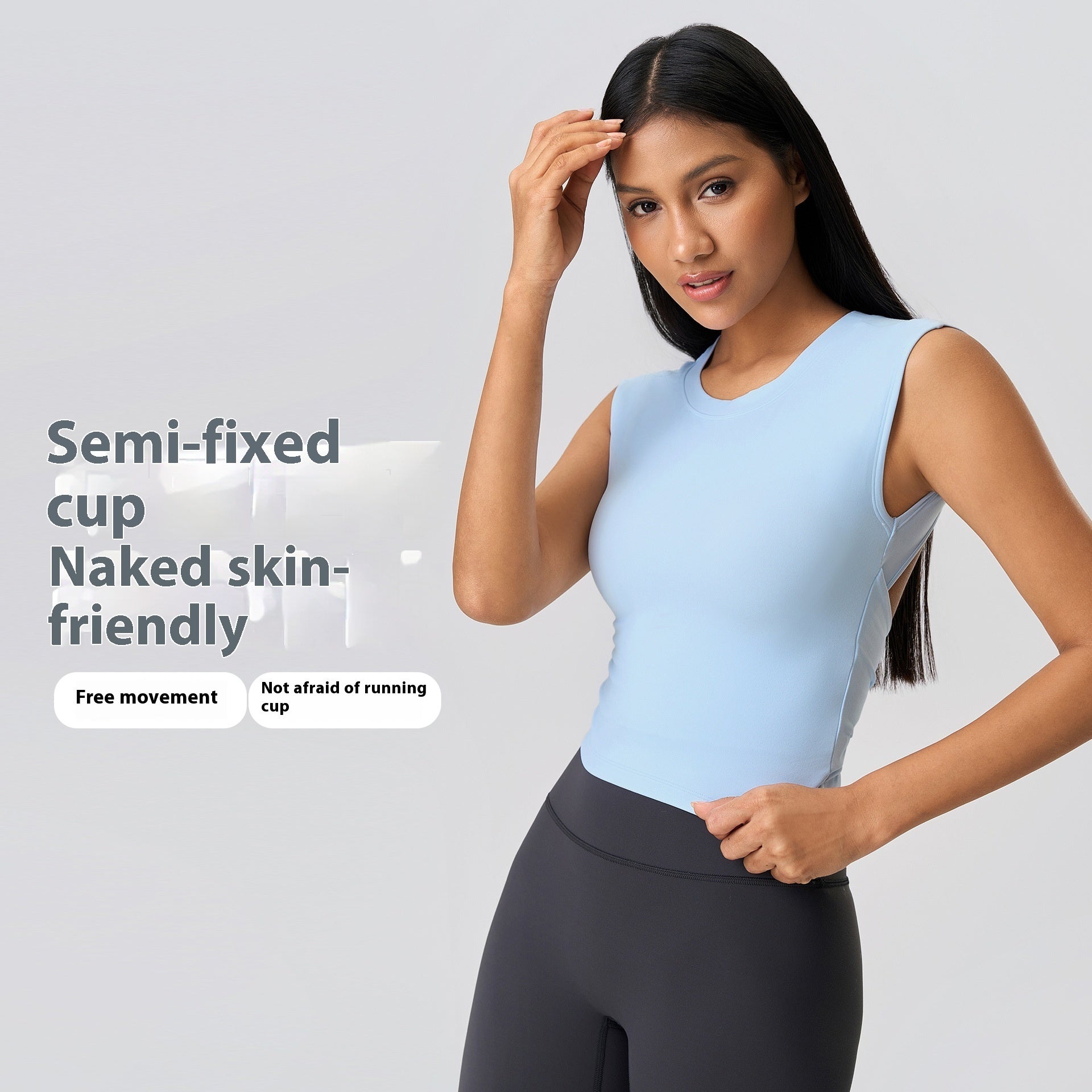 Woman wearing a light blue sports bra and black leggings on a gray background with text about the product features.
