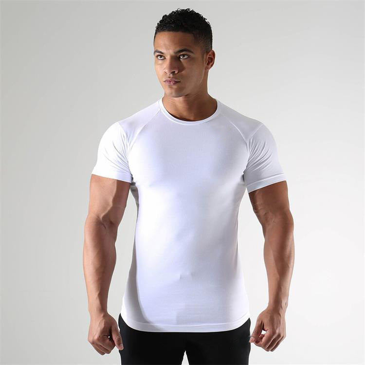 Man wearing a white t-shirt against a plain background