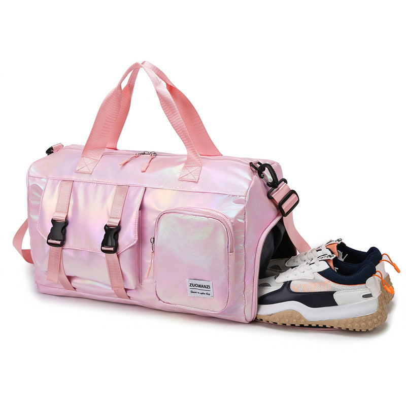 Pink duffel bag with a sneaker peeking out on a white background