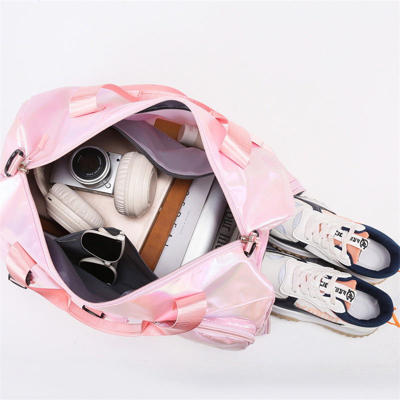 Pink backpack with shoes, sneakers, and a camera inside on a white background
