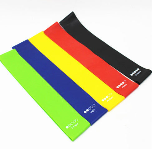 Set of colorful resistance bands on a white background