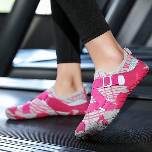 Pink and gray water shoes worn on a treadmill.