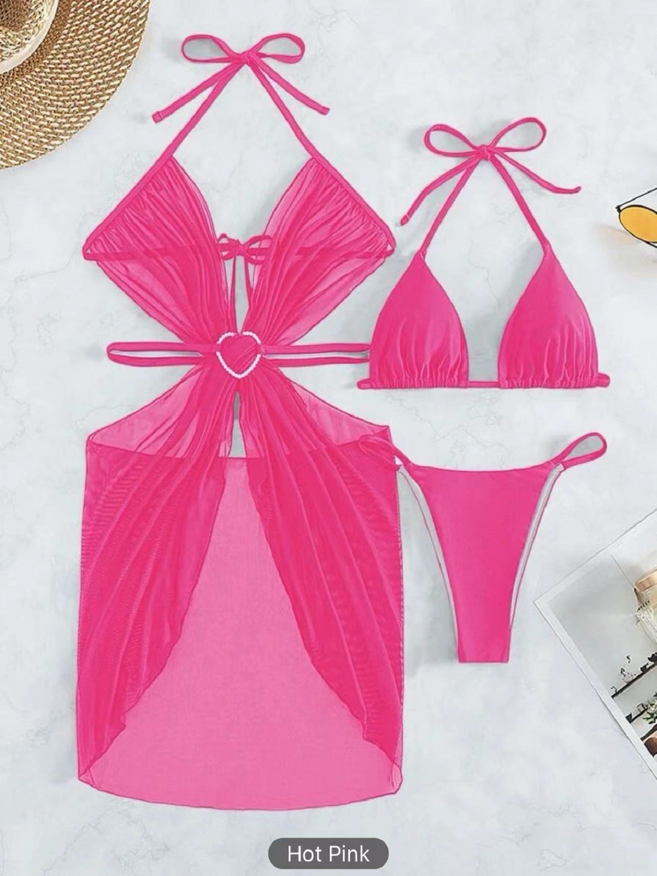 Hot pink bikini set on a white background