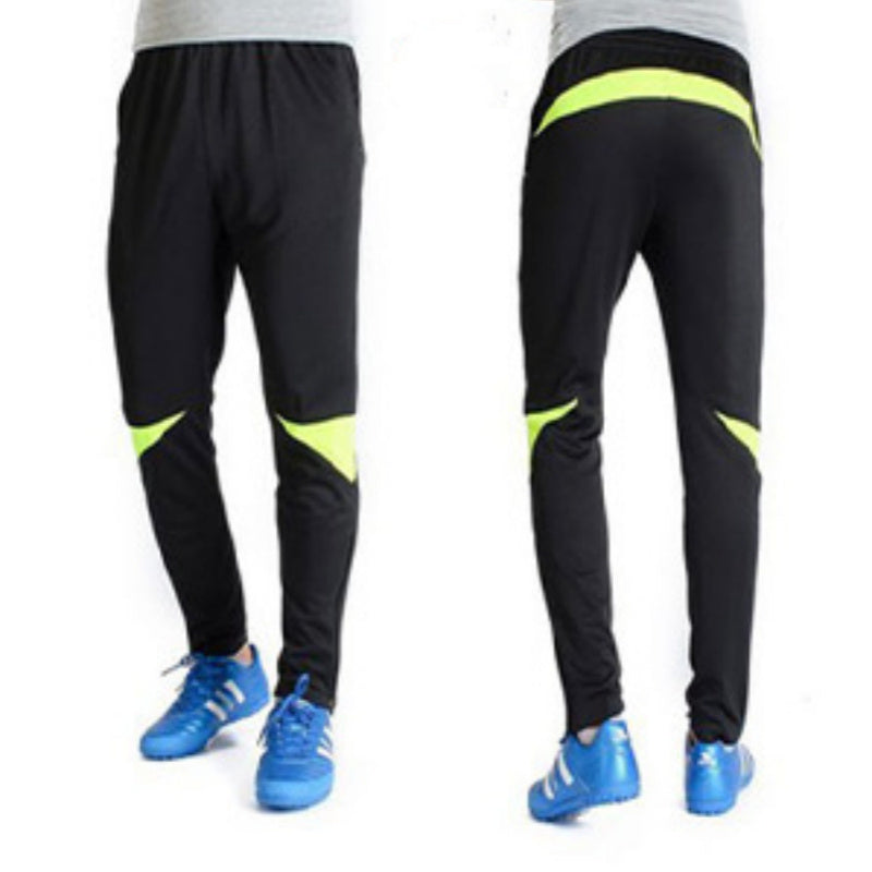 Black pants with green accents worn by a person, shown from front and back views.