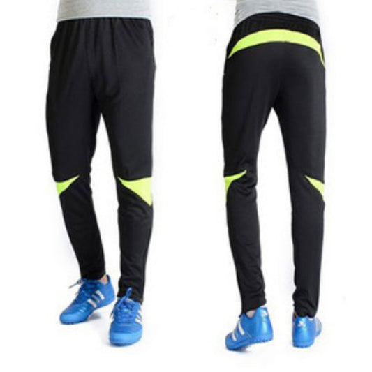 Black pants with green accents worn by a person, shown from front and back views.