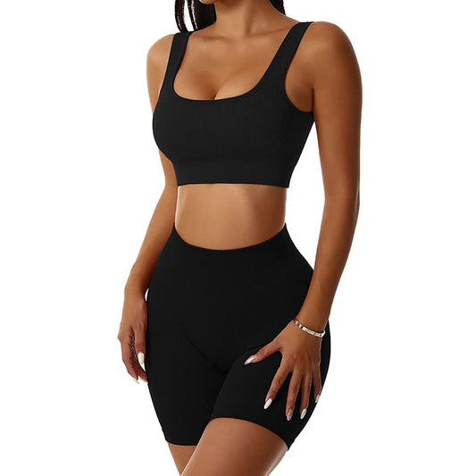 Black athletic outfit worn by a model on a white background
