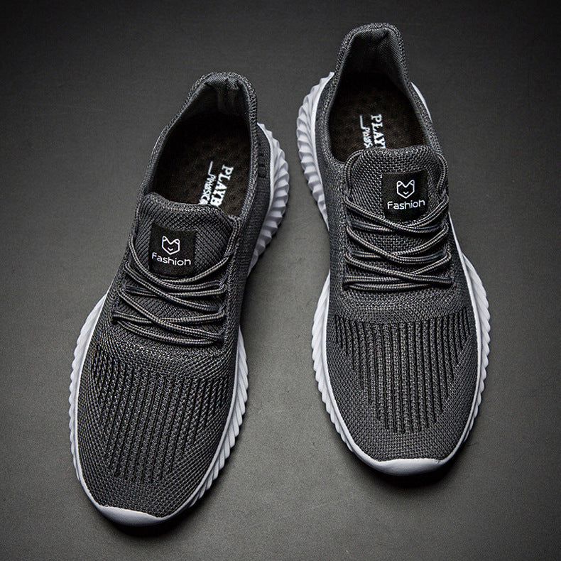 Pair of gray sneakers on a dark background